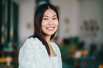 Happy attractive beautiful asian women relax in coffee shop