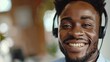 © LukaszDesign - Voicemail, cheerful man, consultant, advisor, virtual communication, or technical help. Insurance agent on headphones for FAQ, help, or customer service closeup