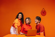 © Jacob Lund - Happy business team in a vibrant monochromatic workspace with orange accents