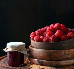 Poster - raspberry jam and fresh berries on wooden background