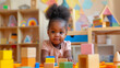 © Anna - Adorable toddler in a peach shirt playing with colorful wooden blocks in a vibrant playroom. Concepts of childhood development, education, and playful learning environments.