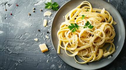 Wall Mural - Top view of a plate of Italian pasta with cheese, classic dish, with background space for overlay text