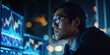 © ronstik - asian trader looking at financial data graphs on computer monitors. stock market and crypto trading