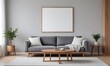 © Sharif54 - Modern living room with a gray sofa, a wooden coffee table, and blank framed Canvas on the wall. The room has a minimalist and cozy atmosphere