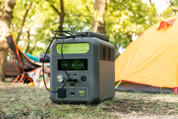 portable power station with lithium ferrophosphate battery charging electronic devices used at a wil