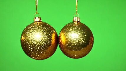 Wall Mural - The Christmas balls hang on a green screen background. Christmas balls frame animation on green screen. Christmas celebration animation. Key color, Chroma key. Merry Christmas