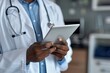 © AntonioJose - Doctor using a tablet in a modern clinic