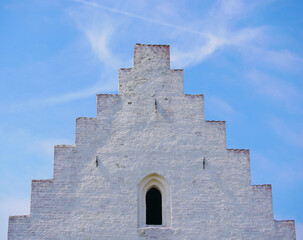 Close up of a top roof part of Den Tilsandede Kirke in Skagen, Denmark. A famous ancient buried in dune church, earlier partially covered with sand