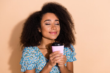 Sticker - Photo of shiny attractive lady dressed blue blouse enjoying beverage empty space isolated beige color background