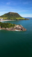 Wall Mural - aerial orbit of famous tourist surf town of mount maunganui, new zealand. the town, mountain and coa
