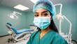© Mathi Loganathan - A portrait of indian dental assistant in modern dental surgery, looking at camera.