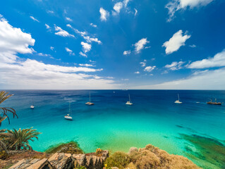 Wall Mural - white sandy beach and blue water in morro jable, south of fuerteventura, canary islands