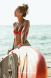 © milanmarkovic78 - Woman With Paddle Board at the Beach