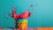 © Juan - Paint splashing from bucket on blue background