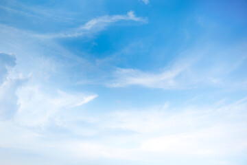 Soft gentle blue sky with light clouds. Calm texture. Nature abstract background. Fresh air, weather and freedom concept.