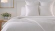 © JP STUDIO LAB - A close-up of a neatly made bed with crisp white linens, fluffy pillows, and a cozy throw blanket, with copy space, high-resolution photo, realistic photo