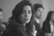 © PHAISITSAWAN - Average female financial advisor in a boardroom meeting with clients.