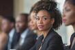 © PHAISITSAWAN - Average female financial advisor in a boardroom meeting with clients.
