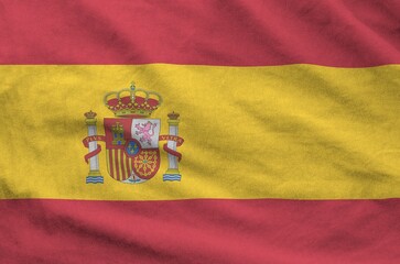 Wall Mural - Spain flag depicted on folded wavy fabric of old cloth close up