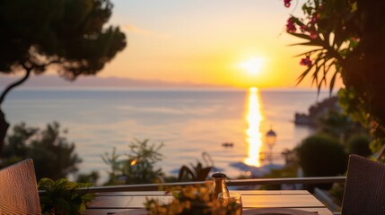 Poster - A table with a salt shaker and a vase of flowers on it overlooking the ocean. The sun is setting, creating a beautiful and serene atmosphere