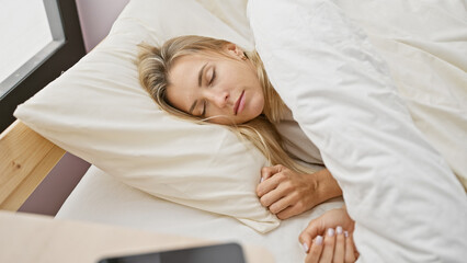 Poster - A serene young woman sleeps comfortably in a bright bedroom, epitomizing tranquil rest and cozy domesticity.