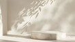 © suldev - Blank cream white cement curve counter podium with texture, soft beautiful dappled sunlight, leaf shadow on white wall for luxury organic cosmetic, skincare, beauty treatment product background