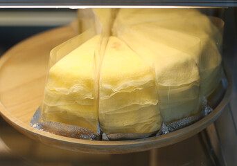 Cakes in glass display case ready for sale at cafe