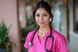 © Mandeep - Smiling Nurse in Pink Scrubs