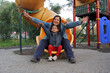 © Arlette - Latin mom plays with her 4-year-old brunette daughter in the park games, they spend quality time together and celebrate Mother's Day
