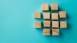 © CreativeCreations - Wooden blocks connected together on a blue background. Teamwork concept