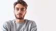 © SHOTPRIME STUDIO - Portrait of a young man in a stylish grey sweatshirt looking confidently at the camera in a business casual fashion style