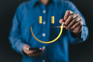 Wall Mural - customer review satisfaction feedback survey concept. man using a pen to draw happy smiling face on 