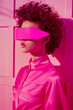 © Erik González - A woman in a pink outfit with a pink mask on her face