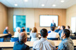 © Rysak - Attentive Audience Listening to a Presentation in a Conference Room