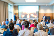 © Rysak - Business conference attendees listen attentively