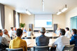 © Rysak - Rear View of Audience Listening to Presentation in Conference Room