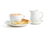 Fototapeta Mapy - Close-up of a cup of coffee, a slice of pie, and a creamer on a white background