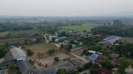 Poster - Aerial view of residential neighborhood roofs with nature forest trees. Urban housing development from above. Top view. Real estate in Bangkok City, Thailand. Local property real estate