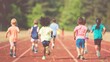 © red_orange_stock - A group of children enthusiastically running on a track field, enjoying active playtime with friends