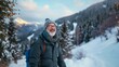 © RaptorWoman - Older man with winter gear smiling during a hike in a snowy mountain landscape, conveying joy and nature's beauty.