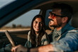 © La Famiglia - Shot of a young couple going a road trip together