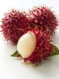 Three rambutans on a white background