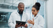 © PeakPoints/peopleimages.com - Diversity, results or doctors with tablet, planning or surgeon reading health treatment in hospital. Meeting, research team or online medical advice with clinic app for web consultation or diagnosis