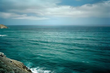 Wall Mural - a view of the ocean from the top of a cliff