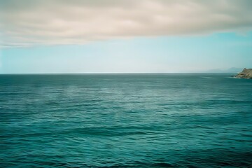 Wall Mural - a view of the ocean from the top of a hill