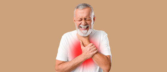 Wall Mural - Ill old man with sore throat on beige background