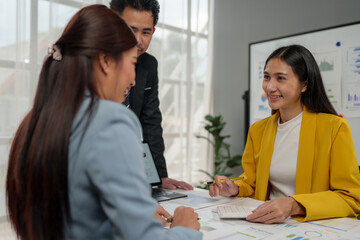 Wall Mural - Financial teamwork with Marketing and Accounting Business professionals working together at office desk, hands close up pointing out financial data on a report negotiation, Analysis, Discussion