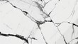 © Annamorphosis - A white and black marble tile floor with cracks and holes