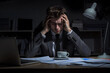 © May Thawtar - A businessman sits at his desk, looking exhausted and stressed.