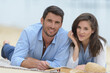 © auremar - couple laying in sand at beach
